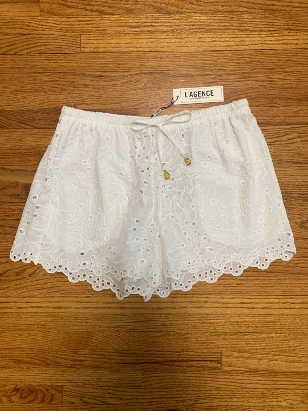 L’AGENCE swim coverup - white eyelet beach shorts w pockets & monstera pattern